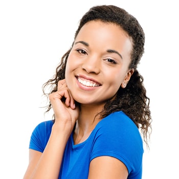 Short Curly Hair Lady in Blue Blouse Lady with short curly hair and wearing a blue blouse is smiling while her right hand is under her right cheek