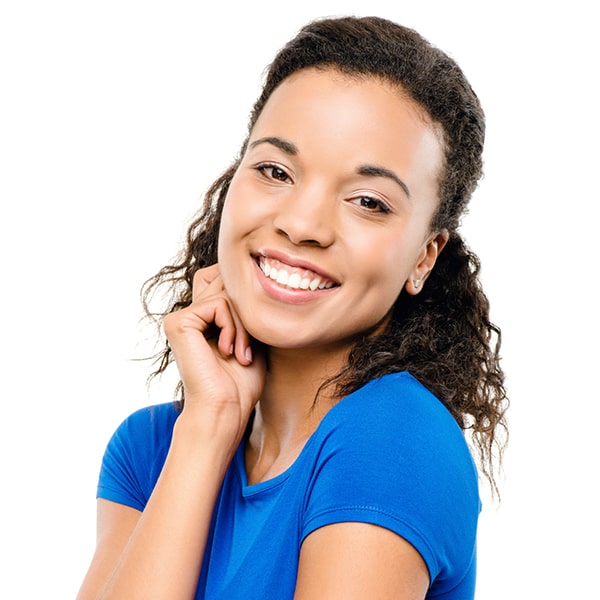 Short Curly Hair Lady in Blue Blouse Lady with short curly hair and wearing a blue blouse is smiling while her right hand is under her right cheek